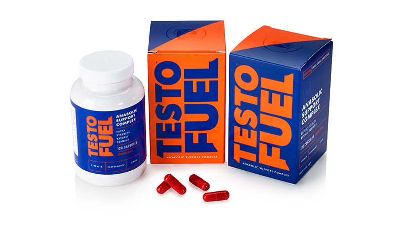 Bottle and two boxes of TestoFuel next to red capsules