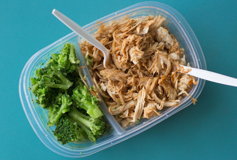 Meal prepped tuna and broccoli to show how bodybuilders can diet on a budget